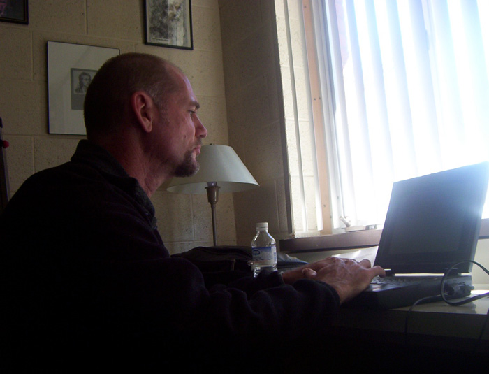 Michael Newberry preparing to give a lecture, 2004 at Rockford College, photo by Stephen Hicks